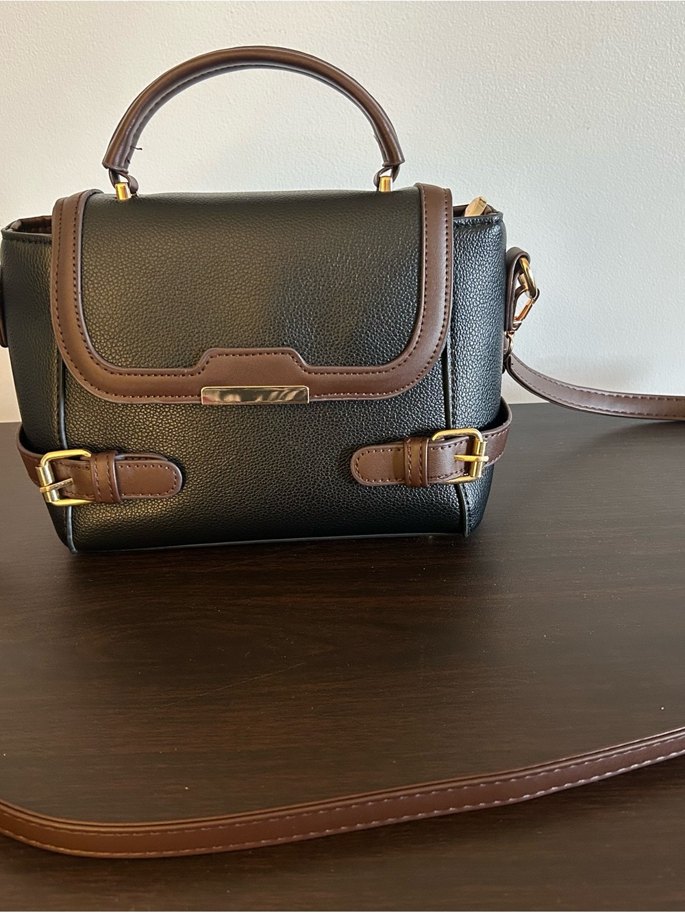 Chic Black Satchel with Brown Trim and Gold Accent